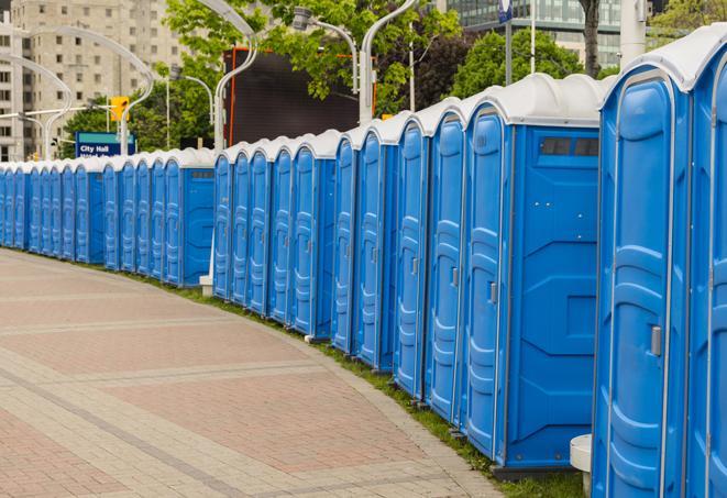 a row of portable restrooms at a fairground, offering visitors a clean and hassle-free experience in mead